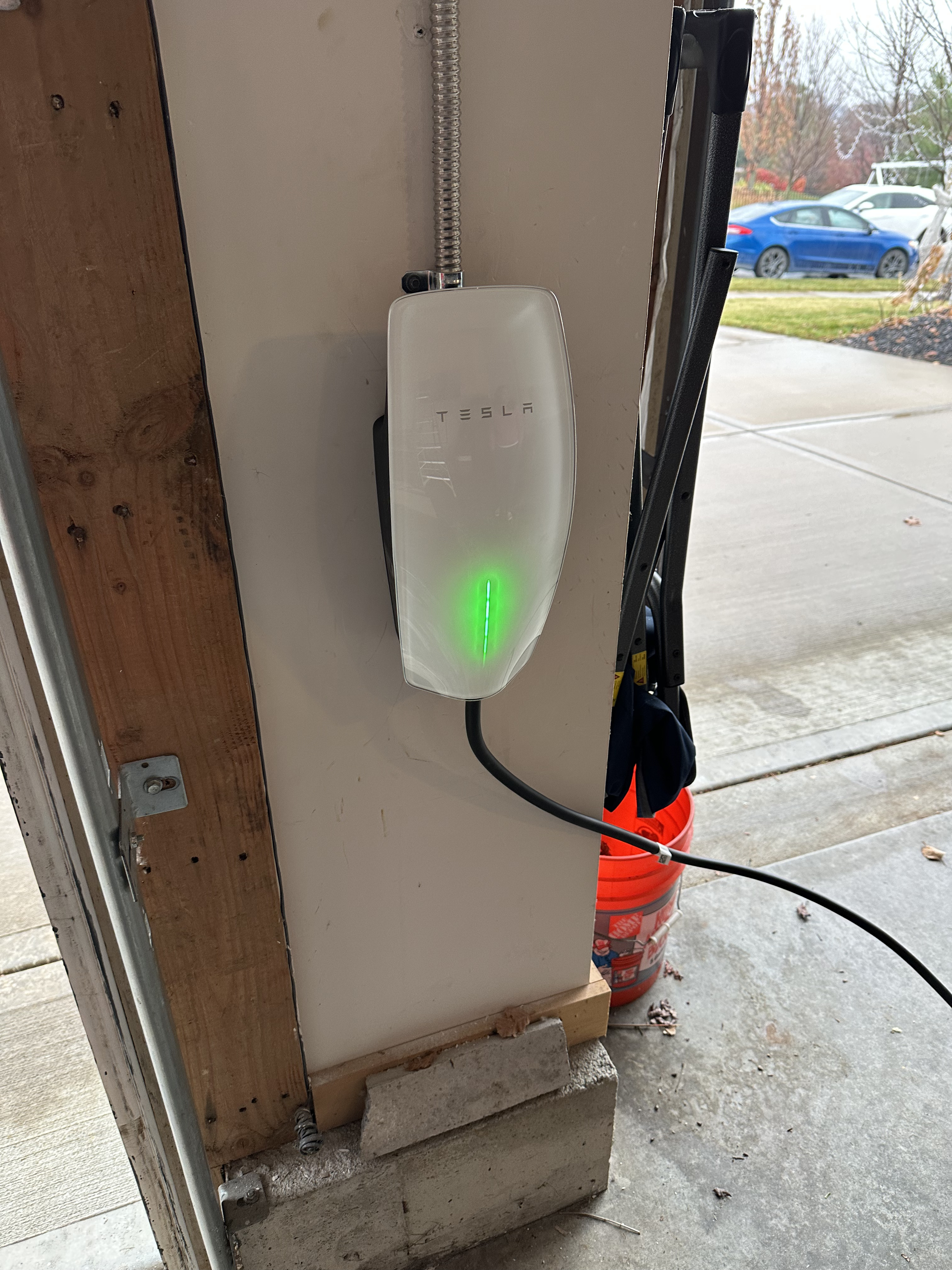 Watt-Zen EV charger installed in a garage bay